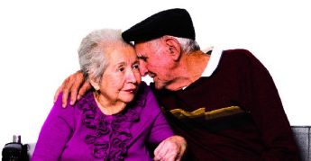 Elderly married couple isolated on a white background.