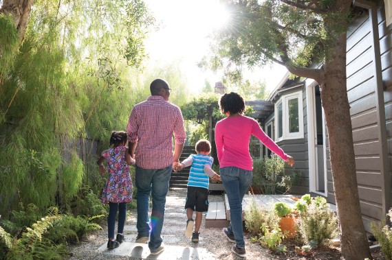 A family holding hands while walking