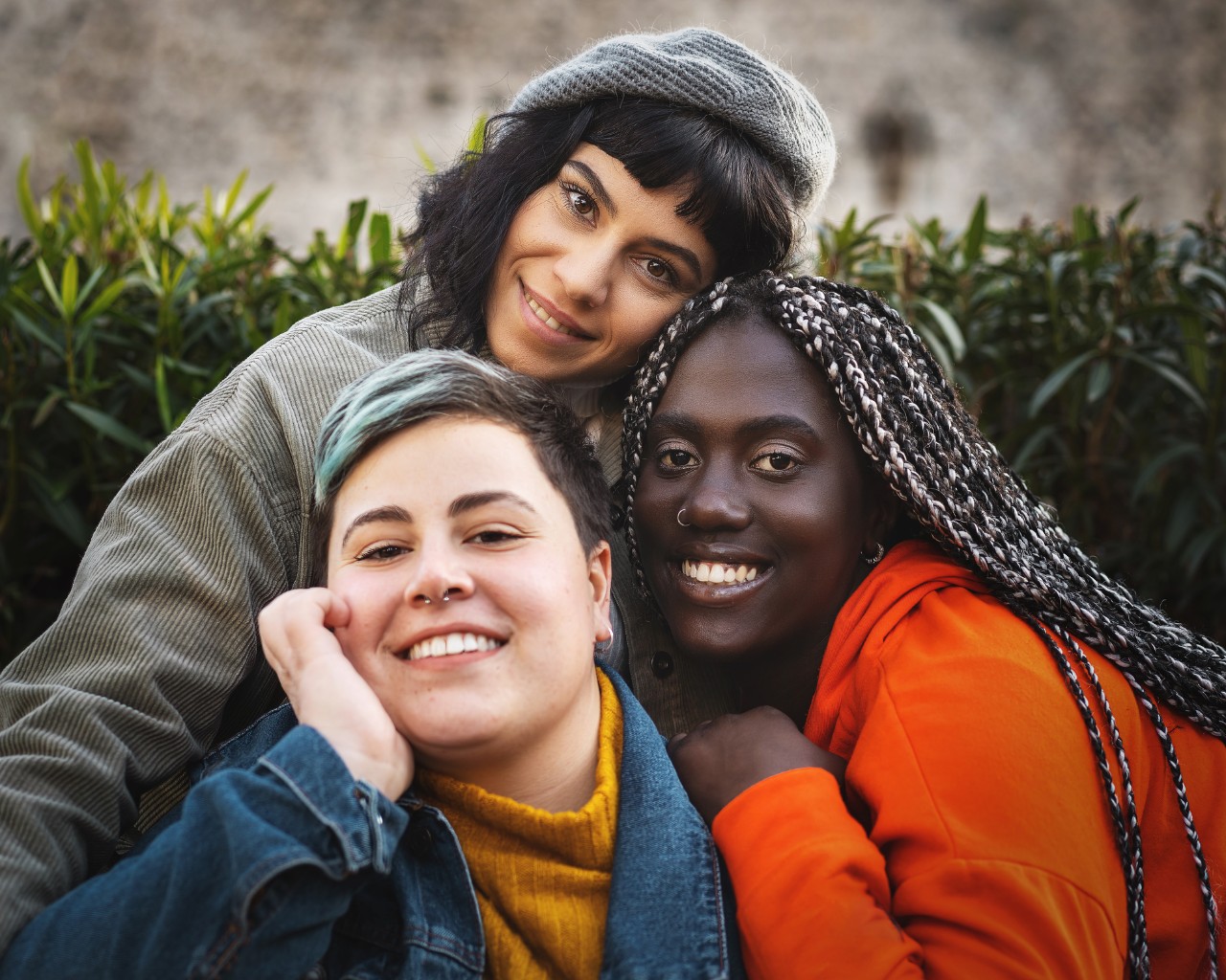 Portrait of multiracial diverse young women smiling and looking at the camera.